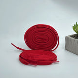 Bold flat laces in cherry red for Air Jordan, Adidas Originals, Yeezy, Puma, and On Cloud trainers