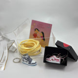 Rakhi gift hamper with sneaker keychain, lace and pendant
