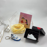 Stylish Rakhi hamper with custom keychain, pendant, and lace