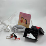 Stylish Rakhi hamper with custom keychain, pendant, and lace
