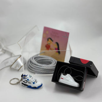Stylish Rakhi hamper with custom keychain, pendant, and lace