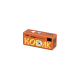 Kodak Charmera keychain camera in orange with pixelated KODAK graphic